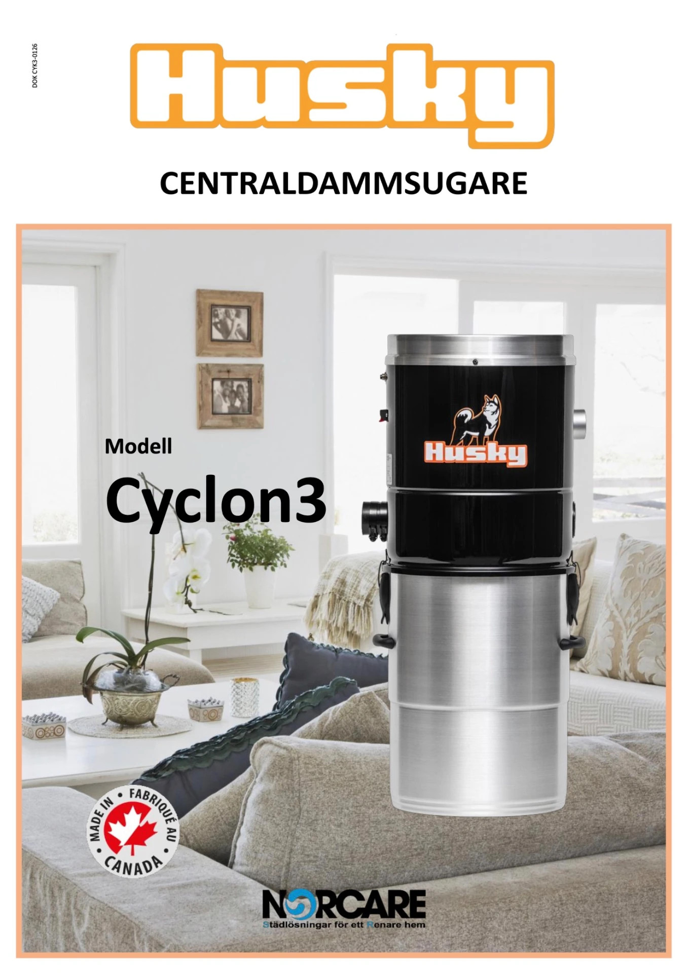 Centraldammsugare Husky Cylon3 i vardagsrum, med orange logotyp och text på affisch.
